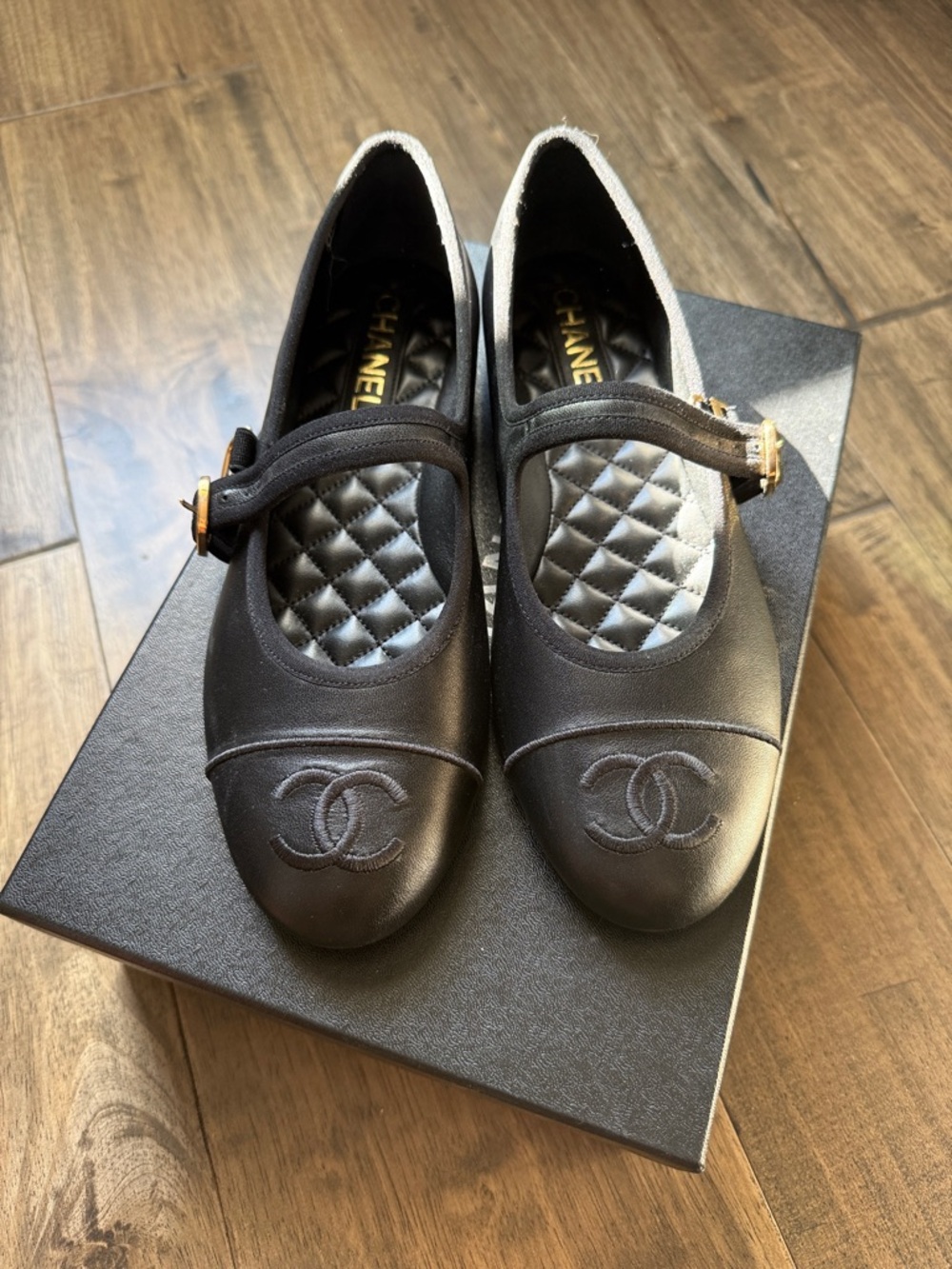 New CHANEL Black Quilted Mary Jane Flats with Gold Buckle Accent
